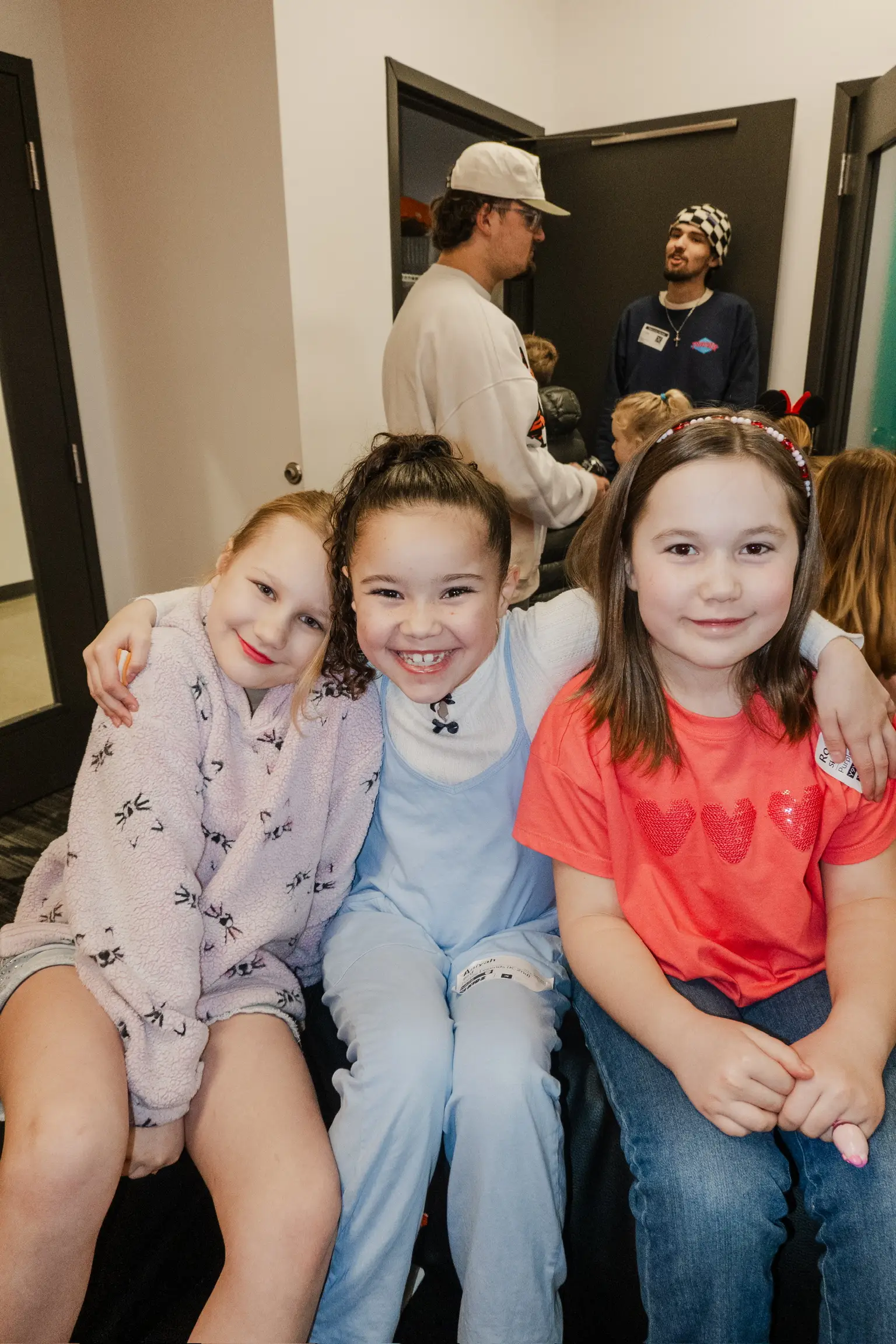Child smiling at X Kids