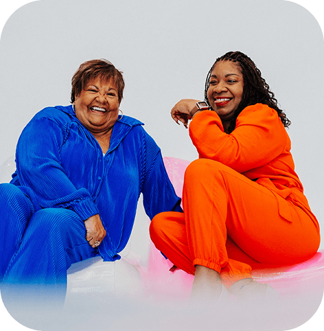 two women in blue and orange