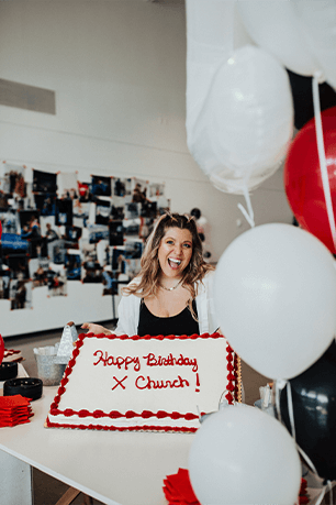 woman holding cake saying happy birthday x church